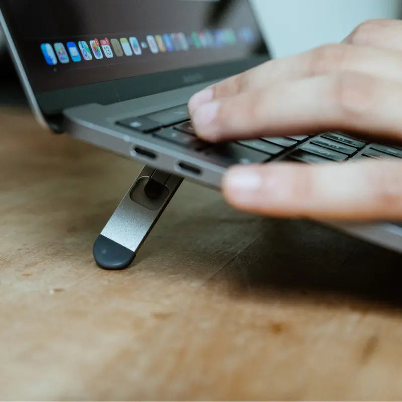 Laptop Portable raiser showing a macbook using it.