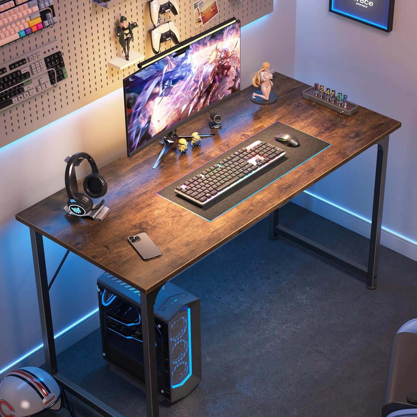 Wooden Rectangular Desk with a gaming computer, a screen, a keyboard, and a mouse.