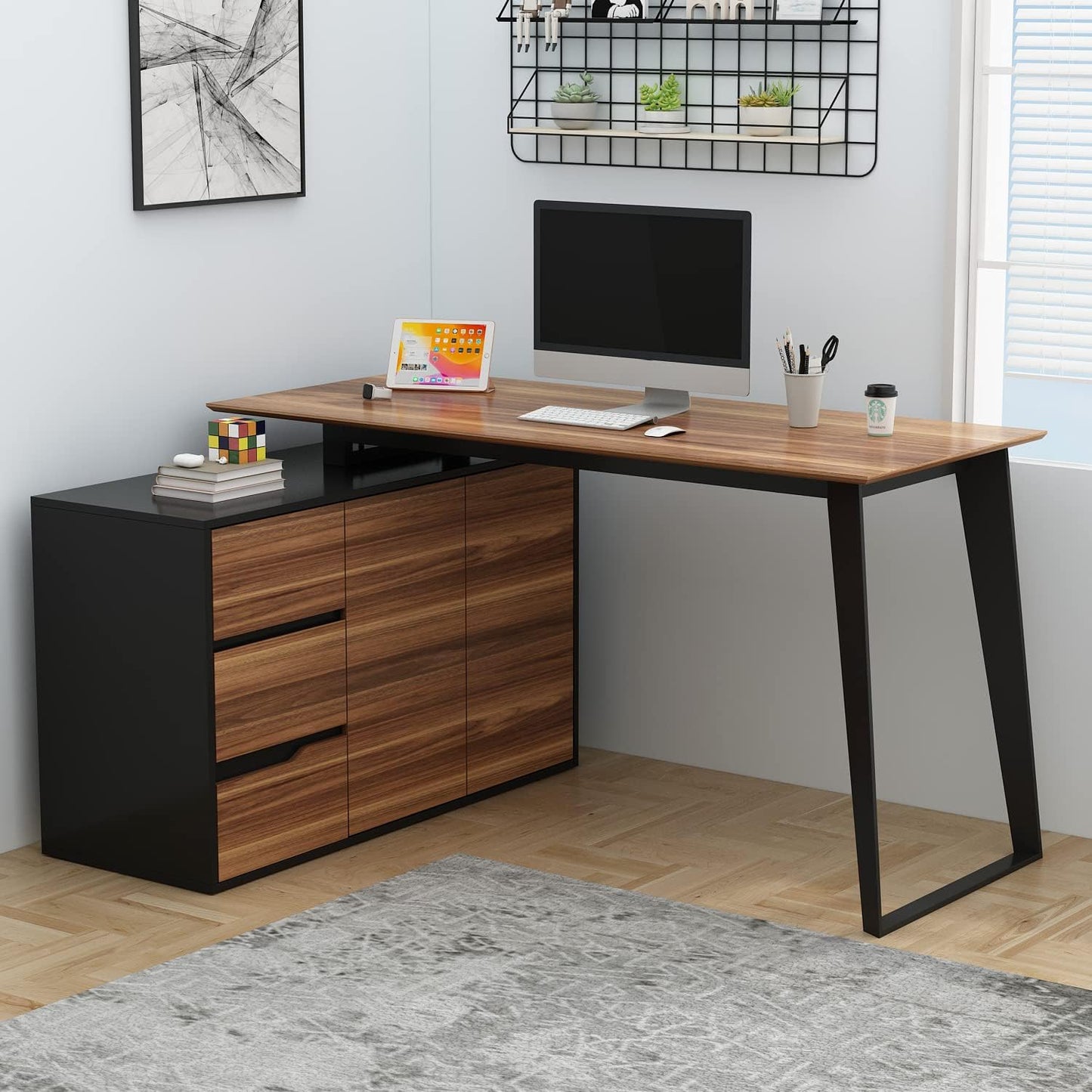 L Shape Black Brown Desk in a room with some a computer alongside other stuff on top of it.