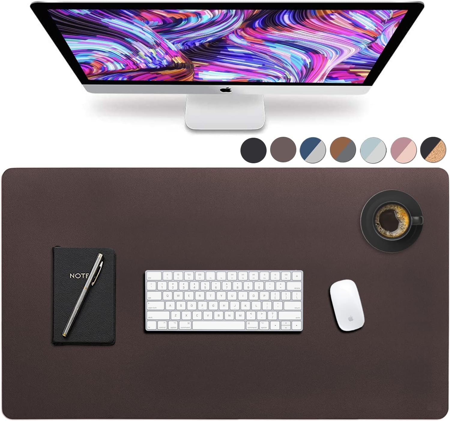 Dark brown desk mat with a computer in front. The desk mat also has a notebook a keyboard and a mouse.