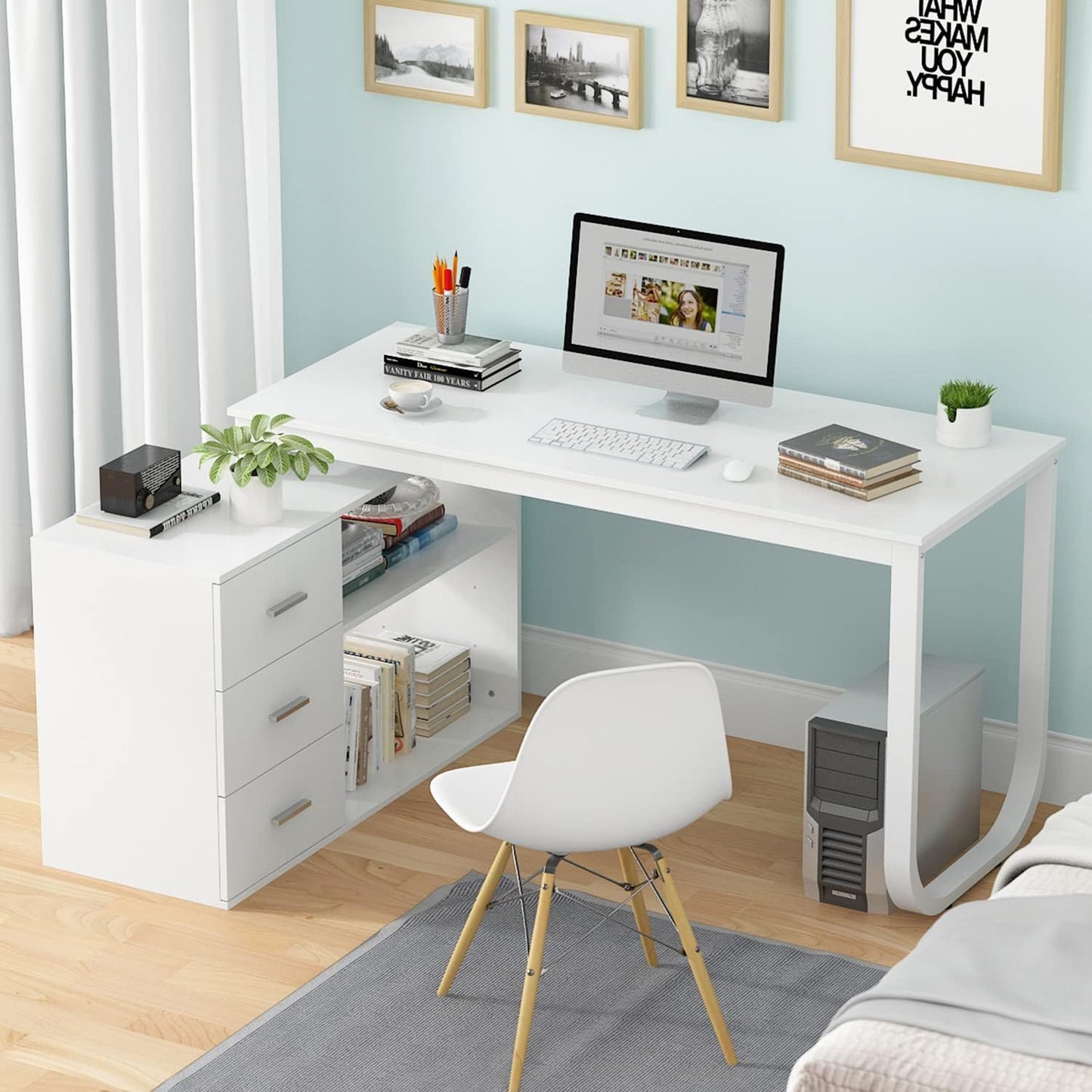 L Shape White Desk in a room with some a computer alongside other stuff on top of it.