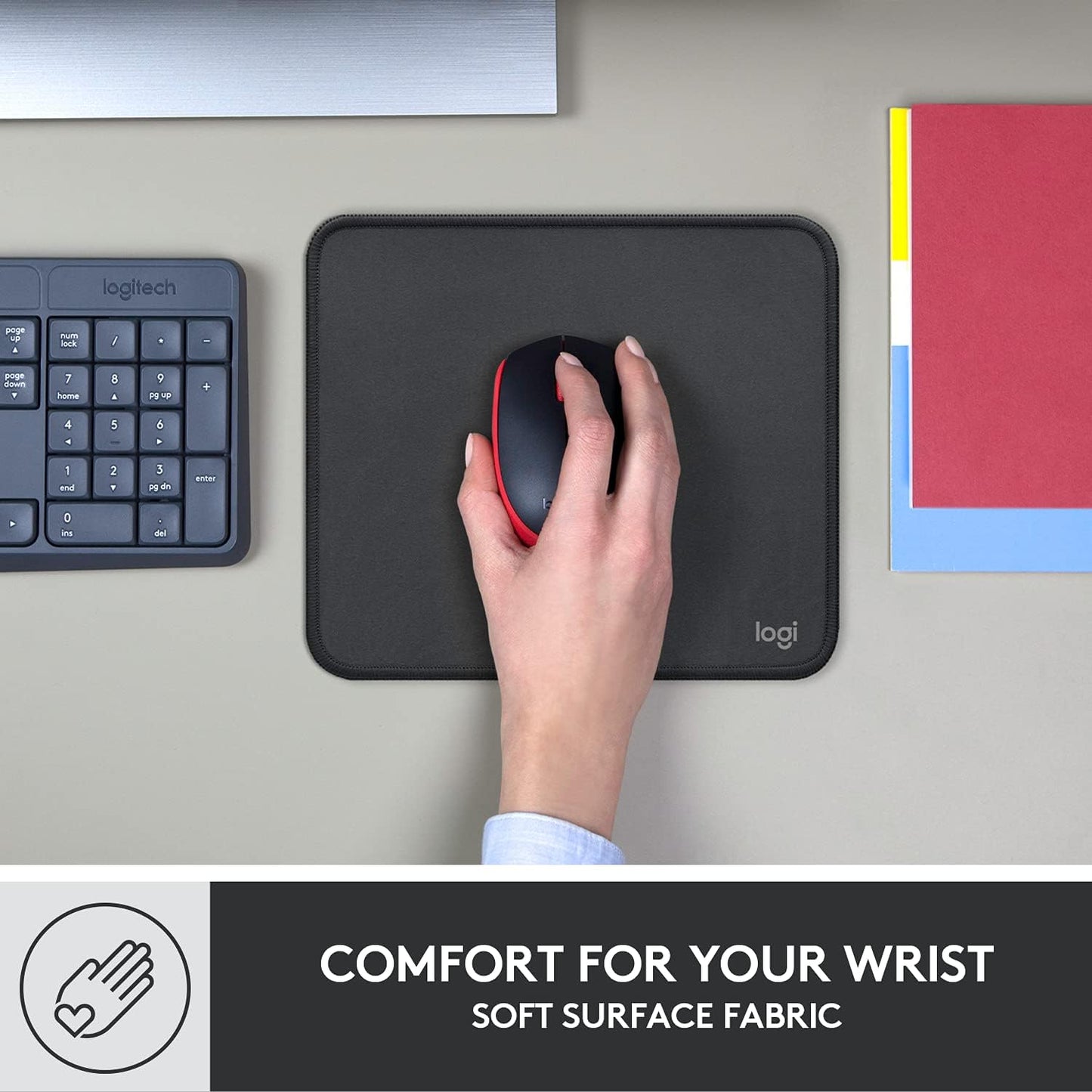 Black Mouse Pad showing how it is comfortable for the wrist. 