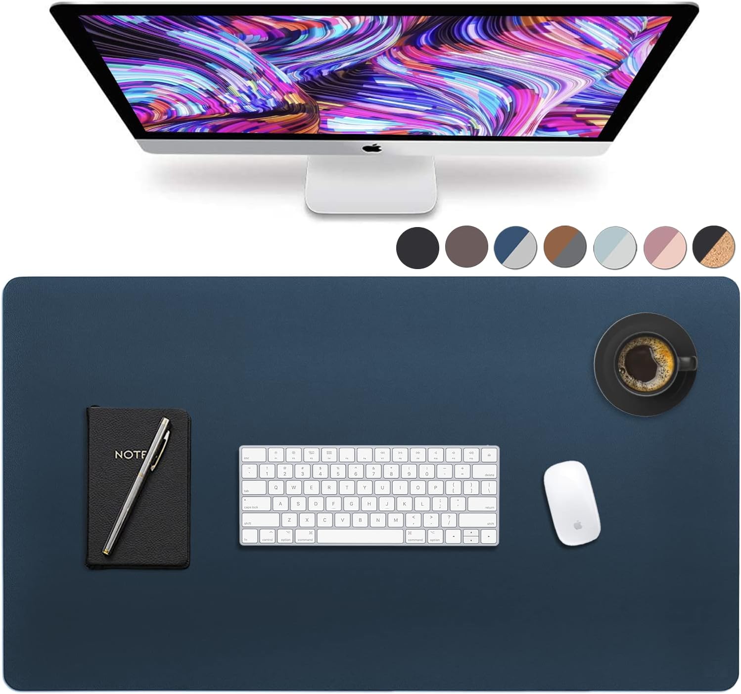 Dark blue desk mat with a computer in front. The desk mat also has a notebook a keyboard and a mouse.