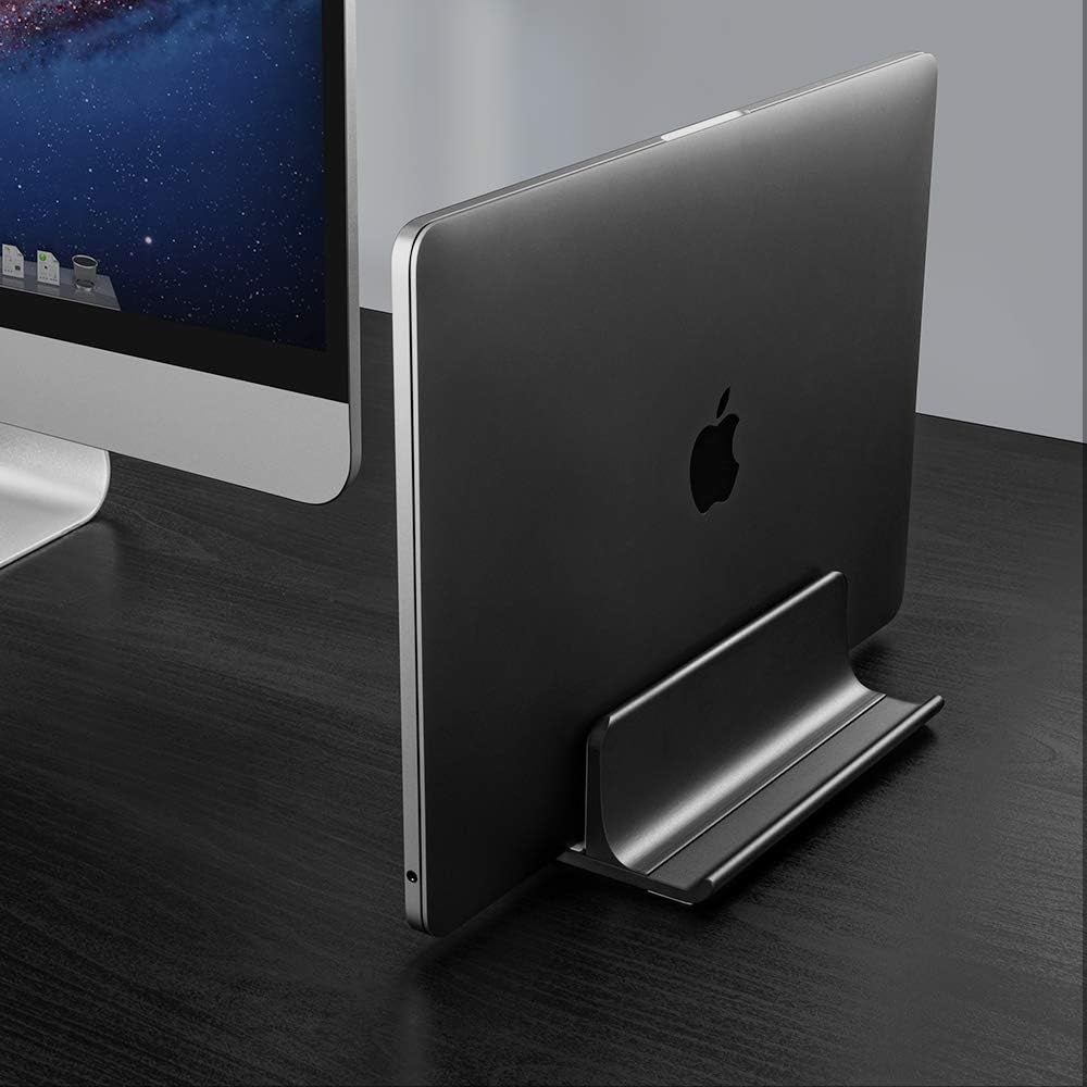 Vertical Laptop Stand in a desk with a macbook.