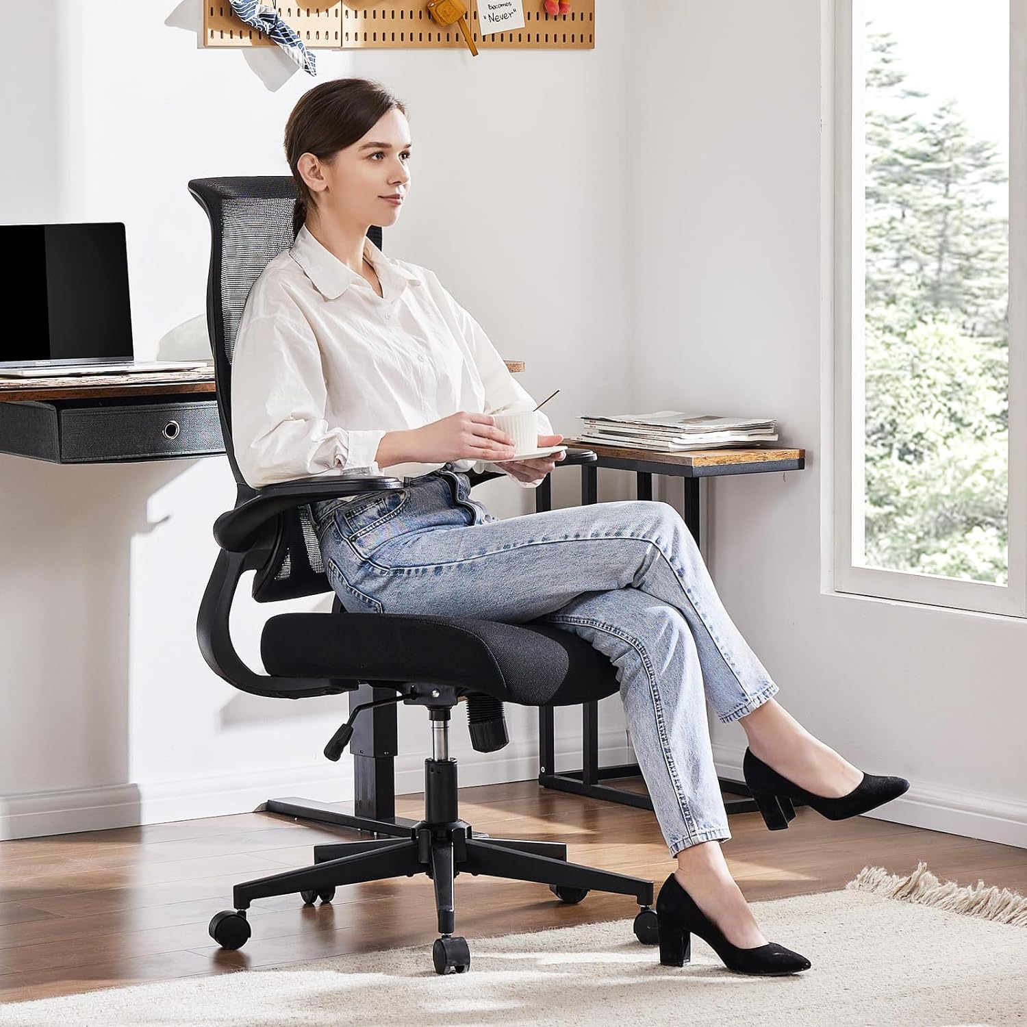 Office Chair with a woman looking to the right while drinking a coffee.